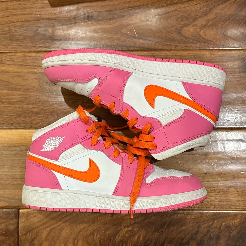 Pink and orange air Jordan 1 mid